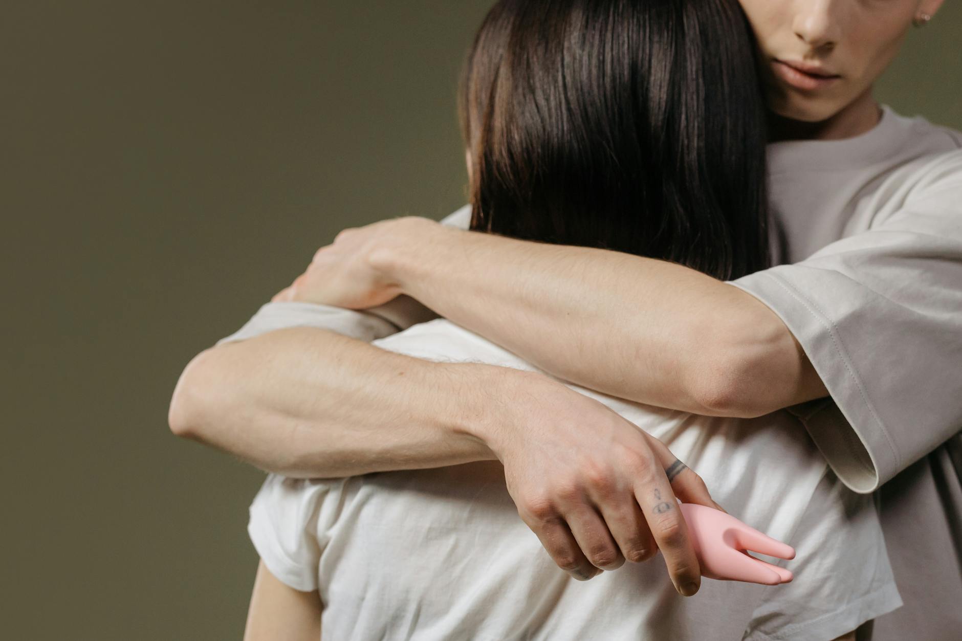 A couple embracing in intimate connection, representing safe and informed pleasure